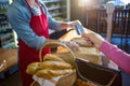 Hand giving credit card at payment counter Royalty Free Stock Photo