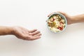 hand giving food bowl needy person. High quality photo Royalty Free Stock Photo