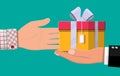 Hand giving gift box to other hand Royalty Free Stock Photo