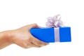 hand giving a gift wrapped in blue box Royalty Free Stock Photo