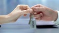 Hand giving key to fortune, secret of raising money, successful business, dream Royalty Free Stock Photo