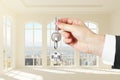 Hand giving keys to new apartments Royalty Free Stock Photo
