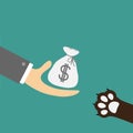Hand giving money bag with dollar sign. Dog cat paw print taking gift. Helping hand concept. Adopt, donate, help, love pet animal. Royalty Free Stock Photo