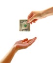 Hand giving money to other hand isolated