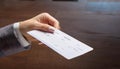Hand giving paycheck, check, cheque Royalty Free Stock Photo