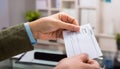 Hand giving paycheck, check, cheque Royalty Free Stock Photo