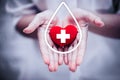 Hand giving red heart for help blood donation hospital Royalty Free Stock Photo