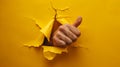 The Hand through Yellow Paper.AI generated image Royalty Free Stock Photo