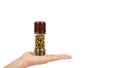 hand with glass pepper mill isolated on white background, hot and spicy flavor. copy space, template Royalty Free Stock Photo