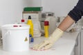 cleaning a spilled liquid next to a container for biological risk