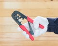 Hand in glove hold wire stripper Royalty Free Stock Photo