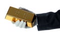 Hand with glove holding a gold bullion