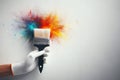 Hand with glove holding paint brush with rainbow color paint splash on white wall background. Renovation, home Royalty Free Stock Photo