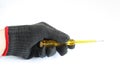 Hand in glove holding a screwdriver Royalty Free Stock Photo