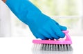 Hand with glove using cleaning brush to clean up Royalty Free Stock Photo