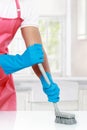 Hand with glove using cleaning brush to clean up Royalty Free Stock Photo