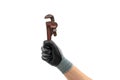 Hand of a gloved man holding a pipe wrench. Isolated white background Royalty Free Stock Photo