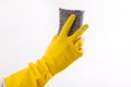 Hand with gloves holding scrubber sponge Royalty Free Stock Photo