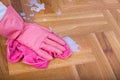 Hand with gloves wiping floor Royalty Free Stock Photo