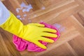 Hand with gloves wiping floor Royalty Free Stock Photo