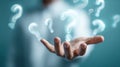 The hand with glowing question marks symbolizing curiosity and exploration. AI generated image Royalty Free Stock Photo