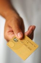 Hand With a Gold Credit Card Royalty Free Stock Photo