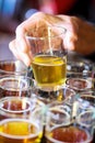 Hand Grabbing a Beer from a Beer Flight