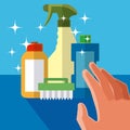 Hand grabbing cleaning products