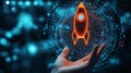 A hand grasping a luminous neon rocket ship launch concept Royalty Free Stock Photo