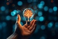 Hand grasps virtual lightbulb amid brain bokeh, igniting creative ideas