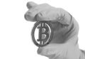 Hand in Gray Glove holds Bitcoin Crypto Currency.Mining concept. Royalty Free Stock Photo