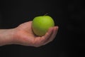 Hand with green apple Royalty Free Stock Photo