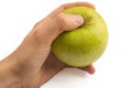 In a hand a green apple isolated on a white background Royalty Free Stock Photo