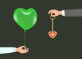 Hand with green balloon and other hand with Jewelry.