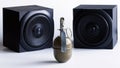 Hand grenade, next to two audio speakers. A metaphor for powerful sound or explosive audio and explosive music. A study of sound Royalty Free Stock Photo