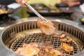 Hand Grilling meat pork on stove serve in restaurant. Japanese food and Korean BBQ traditional style Royalty Free Stock Photo