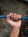 Hand Gripping Rope Close-Up Royalty Free Stock Photo
