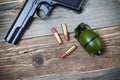 Hand gun, grenade and cartridges Royalty Free Stock Photo