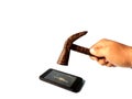 Hand with hammer destroying a smartphone on white background