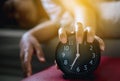 Hand hates getting stressed waking up early,Female stretching her hand to ringing alarm to turn off alarm clock Royalty Free Stock Photo