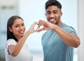 Hand in heart, key and portrait of couple in new home for property, apartment and real estate investment. Relationship Royalty Free Stock Photo