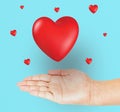 Hand with heart shape isolated on light blue background Royalty Free Stock Photo