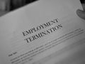 Hand held Employment Termination letter. Royalty Free Stock Photo