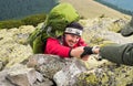 Hand helping hiker to climb the mountain Royalty Free Stock Photo