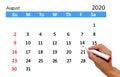 Hand highlighting date on calendar Royalty Free Stock Photo