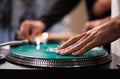 Hand of hip hop dj scratching vinyl record on turntables. Professional disc jockey scratches records on party in night club on