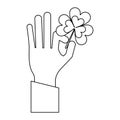 Hand hoding clover shamrock symbol in black and white