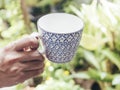 Hand hold Asian Blue and White Vintage Mugs Coffee Tea