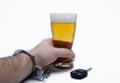 Hand Hold Beer with Handcuffs and Car Key