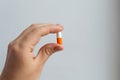 Hand hold big capsule pill of the azithromycin antibiotic Royalty Free Stock Photo